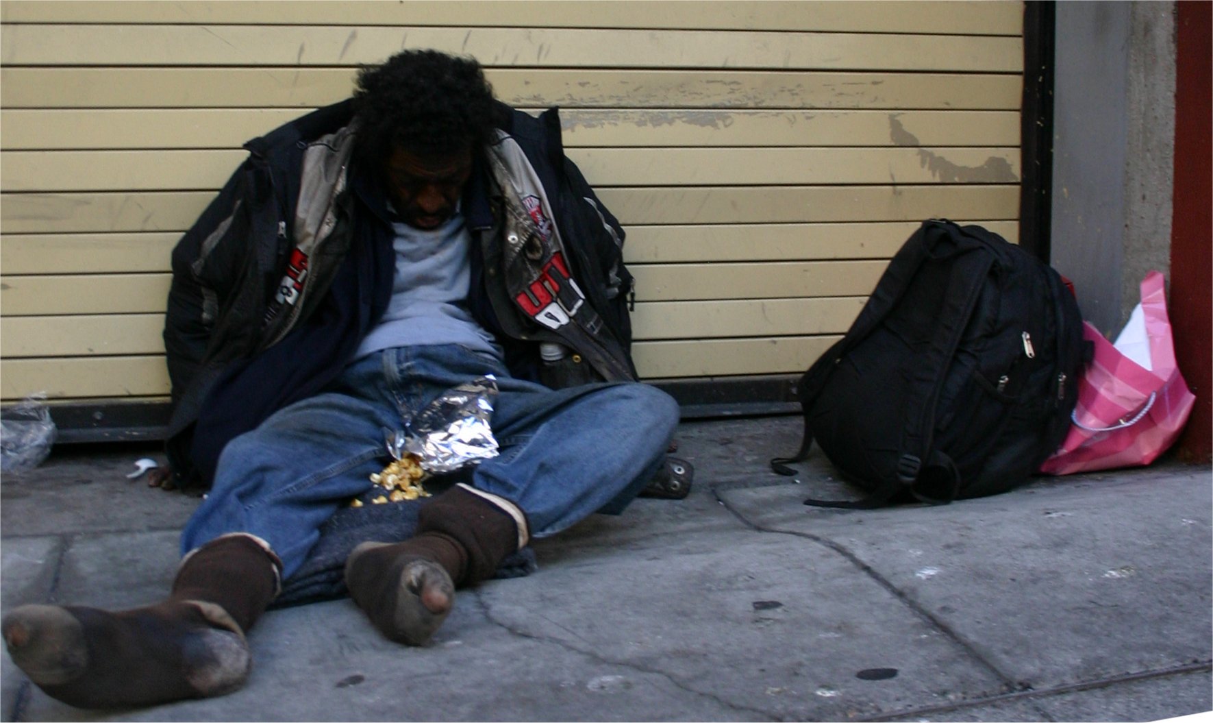 I saw this homeless guy the other day, head down, asleep: Wearing 4 jackets...